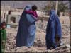 Women at a cemetery